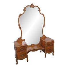 an antique wooden vanity with mirror and drawers