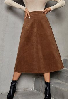 The EMES SHOP skirt is detailed with a gorgeous A-line silhouette. Features solid color. high waist. corduroy material. and mid-calf length. Pair it with a turtleneck and ankle boots for a chic look.MATERIAL:95% Polyester 5% ElastaneMEASUREMENTS: Product Length 30"-31.5"in 4-6-Small | Waist: 25"-26.5"in | Hips: 33.5"-35"in 6-8-Medium | Waist: 26.5"-28"in | Hips: 35"-36.5"in 8-10-Large | Waist: 28"-29.5"in | Hips: 36.5"-38"in 10-12-X-Large | Waist: 29.5"-31"in | Hips: 39.5"-41"in MEASUREMEN... Winter A-line Solid Color Bottoms, Winter A-line Bottoms In Solid Color, Brown Solid Color Skirt For Fall, Corduroy Skirt For Winter, Corduroy Lined Skirt Bottoms For Fall, High Waist Corduroy Skirt For Fall, Corduroy Skirt For Fall Workwear, High-waist Corduroy Skirt For Fall, Fall Corduroy Skirt For Workwear