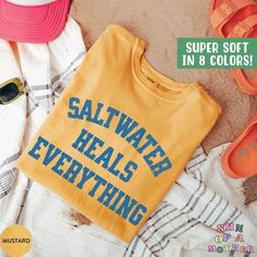 This Saltwater Heals Everything Shirt is the perfect trendy beach tshirt, gift for beach lover, and summer beach tee! Our Comfort Colors tees are super soft, DTG printed (printed with ink), and 100% cotton. ❗❗There may be a slight difference in the colors due to different monitors. ❗❗ 🌞 HOW TO ORDER 🌞 * Select your size and color from the drop-down menu * Add your shirt to cart. If you would like more than one, add each one to cart individually. * Proceed to check out! * Your shirt will be rea Casual Multicolor T-shirt For Beach Season, Casual Printed T-shirt For Beach Season, Affordable Cotton T-shirt For Beach Season, Playful Beach T-shirt For Spring, Playful Graphic Print T-shirt For Beach Season, Vacation T Shirt, Nantucket Sweatshirt, Ocean Tshirt, Hibiscus Shirt