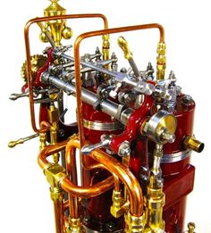 a red and gold machine is shown on a white background