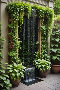 an outdoor shower surrounded by potted plants and greenery on the side of a building