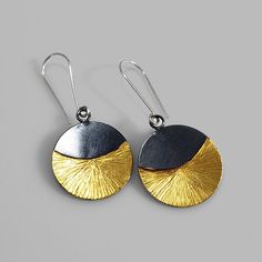 A stunning pair of earrings that hold a beautiful shine and transition from day to night with ease. Made of sterling silver, 14k gold keum boo and finished with a dark patina. Measure: about 2 inches down. Arrives to you in a gift box with foam padding and tissue paper. This item is a special made to order piece. Please allow me at least one week to complete your piece before it is shipped. If you need this item right away or shipped to a different location please contact me. Hand Forged Black Earrings For A Gift, Hand Forged Black Earrings As A Gift, Sterling Silver Dual-tone Earrings For Gift, Gold Oxidized Earrings For Gift, Gold Oxidized Finish Earrings For Gift, Dual-tone Round Earrings For Gift, Keumboo Jewelry, Ancient Korean Art, Surface Embellishment