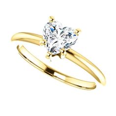 a yellow gold ring with a heart shaped diamond