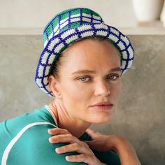 Hand-crocheted by female artisans in Java, Indonesia, this Wimbledon plaid crochet hat is a reminder of the beautiful feeling of being outdoor. Its fresh green grass and bright blue sky color invite us to celebrate the seasons in the sun. 100% Cotton Biodegradable, ethically made Hand wash, dry clean Green Hand-knitted Beach Hat, Green Knitted Summer Hat, Green Hand Knitted Beach Hat, Green Knitted Crochet Hat For Summer, Green Knitted Hat For Spring, Green Hand-knitted Crochet Hat For Summer, Green Crochet Bohemian Bucket Hat, Summer Hand-knitted Green Crochet Hat, Summer Green Hand-knitted Crochet Hat