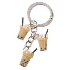 two iced coffees are hanging from a metal keychain on a white background