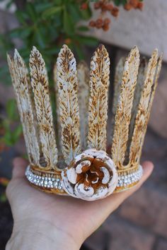 Handmade rusted crown with flower and crystals. These crowns are 100% handmade. They soldered from metal, not flimsy, but very sturdy. I painted them with a homemade paint for that shabby and unique look. Added some silver tone crystals and rusted flower. This is the large size crown from the bunch. The measurement: Large - 4" in diameter ( 12" in circumference) About 4 1/4" high These tall rustic crown can be used for so many projects. Have fun and enjoy creating and decorating. Handmade Crown, Crown Decor, Homemade Paint, Leaf Crown, Angel Statue, Angel Statues, Tiaras And Crowns, Trending Gifts, Tiara