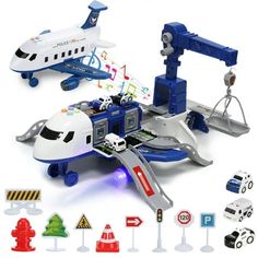 a toy airplane with various vehicles around it