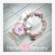 "Please find instructions for using Stretch Magic in a video posted on my Facebook page http://www.facebook.com/michelleandcompany7 Ballerina Ballet Tutu BOHO style DIY charm bracelet. Each kit includes a 12 inch length of stretchy cord (Stretch Magic), an assortment of 14 unique designer beads, silver tone spacers and a Ballerina Tutu charm.  The beads in the kit will make a 7 inch bracelet, if you remove one of the beads it makes a 6.5\" bracelet. You will receive each bracelet kit packaged in Pink Adjustable Stretch Bracelet For Party Favors, Pink Handmade Craft Supplies For Party Favors, Handmade Pink Craft Supplies For Party Favors, Pink Beaded Stretch Bracelet For Party Favors, Pink Beaded Bracelets For Party Favors, Handmade Pink Bracelets For Party Favors, Handmade Pink Stretch Bracelet For Birthday, Pink Beaded Stretch Bracelet For Birthday, Personalized Pink Beaded Bracelets For Crafting