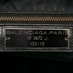 Founded in San Sebastian, Spain in 1918, the House of Balenciaga relocated to Paris in 1937 during the Spanish Civil war. Almost immediately Cristóbal was hailed as 'the couturier of couturiers.' Past designer Nicolas Ghesquiere, had revitalized the company with a youthful aesthetic, introducing the famous motorcycle inspired handbags. Successor to Alexander Wang, current Creative Director Demna Gvasalia upholds the brand’s rejuvenating aesthetic with high-fashion streetwear and graphic-driven s Pre-owned Classic Shoulder Bag For Travel, Classic Pre-owned Business Shoulder Bag, Pre-owned Classic Business Shoulder Bag, Rectangular Travel Bag With Logo Plaque, Luxury Logo Plaque Shoulder Bag For Travel, Luxury Shoulder Bag With Logo Plaque For Travel, Luxury Travel Shoulder Bag With Logo Plaque, Classic Black Shoulder Bag With Engraved Logo, Leather Shoulder Bag With Logo Plaque For Travel