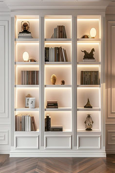 Elegant bedroom with classic white shelving, books, and ornaments under soft lighting, embodying sophisticated bedroom shelving ideas. Decoration For Shelves, Office Shelving Decor, Room Shelves Bedroom Ideas, Classy Bookshelves, Classic Library Design, Books Design Ideas, New Classic Bedroom Design, Book Shelves Design, Library For Home