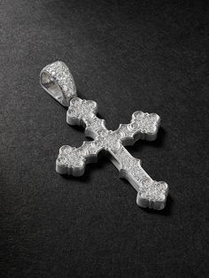 Alex Moss designs larger-than-life jewellery, often custom for artists like Tyler, the Creator. In the same French Gothic style as its namesake cathedral, this ‘Notre Dame’ cross pendant is cast from 14-karat white gold and covered with glistening pavé diamonds, even along the bale. Designer Engraved White Gold Jewelry, Luxury Cross-shaped Diamond Jewelry, Luxury Diamond Cut Cross Jewelry, Luxury Cross-shaped Diamond Cut Jewelry, Luxury Engraved Diamond White Jewelry, Luxury White Gold Crucifix Jewelry, Luxury Engraved Cross Jewelry, Luxury Cross Pendant Jewelry With Polished Finish, Luxury White Cross Jewelry