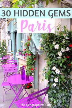 purple tables and chairs in front of a building with flowers growing on the outside wall