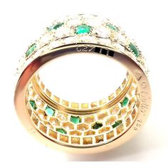 About This Piece: Metal: 18k Yellow Gold Size: European 52, US 6  Weight: 9.8 grams  Width: 13mm  Stones: Round brilliant cut diamonds VVS1 clarity, F-H color And Buff Top emeralds total weight approximately 5.50ct  Hallmarks: Cartier 750 52 627XXX(serial number omitted)   Please refer to the dimensions in the description above for accurate measurements. Please reach out to the seller with any questions on dimensions or fit prior to purchase. Vintage Designer Jewelry, Wide Band Ring, Wide Band Rings, Wide Bands, Round Brilliant Cut Diamond, Brilliant Cut Diamond, Earring Necklace, Ring Necklace, Band Ring