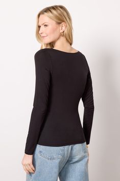 Perfect for a chic night-out look, this long sleeve top by LNA is crafted in rayon-blend fabric and features a fitted silhouette with a flattering ruched front design. Pair with vegan leather, or add wide leg jeans and pumps. | LNA Women's Simone Top, Size XS, Black Stretch Ruched Long Sleeve Blouse, Long Sleeve Ruched Top For Night Out, Ruched Long Sleeve Top For Night Out, Ruched Fitted Long Sleeve Top For Fall, Elastane Tops For Night Out In Fall, Fitted Long Sleeve Ruched Blouse, Sleek Fitted Long Sleeve Top, Black Long Sleeve Top For Fall, Sleek Long Sleeve Tops For Fall