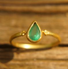 emerald drop gold ring//artisan emerald ring//emerald 24k gold ring//emerald ring//24k gold ring//emerald gold ring//24k gold earring emeralds are one of my favorite gem to work with, seeing them on screen amazes me. It's a true one of kind.  The stone is drop emerald 8x5 mm.  (0.35"x0.2")                      I used 24k gold for the setting and 22k for the rest of the wire (shank) ring (1.4 mm wire) I have done matching studs, and i can make a matching pendant/bracelet. with any custom order yo Gold Teardrop Emerald Ring, 22k Gold Green Jewelry For Anniversary, Green 22k Gold Jewelry For Anniversary, Teardrop Emerald Ring In Yellow Gold, Teardrop Emerald Ring As Gift, Teardrop Emerald Ring For Gift, Handmade Elegant Emerald Ring In Yellow Gold, Elegant Handmade Emerald Ring In Yellow Gold, Elegant Handmade Yellow Gold Emerald Ring