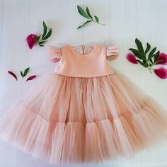 "This beautiful baby girl dress is suitable for baby girls, kids and toddlers. Perfect outfit for formal events, as flower dress, birthday party and photo shoot. The dress is made of blush pink tulle and has short butterfly sleeves.This dress is very lightweight and fluffy. The tulle is soft and not itchy, it is very comfortable for kid's skin. We make dresses in standard sizes and by individual measurements. If your measurements differ from those below please send us your measurements in order Party Dress Christmas, 1st Birthday Dress, Blush Pink Dress, Dress Butterfly, 1st Birthday Dresses, Toddler Party Dress, Blush Pink Dresses, Christmas Clearance, Dress Christmas