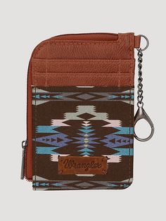 Southwestern art print on canvas Two credit card slot Zip-top closure, fabric lining Wrangler logo "W" on the back Attached split key ring Double round handle (drop: 5.75") 10.5" X 3.5" Western Hey Dudes, Cowgirl Vibes, Western Gifts, Southwestern Art, Southwestern Print, Round Handle, Hey Dude, Zip Top, Card Case