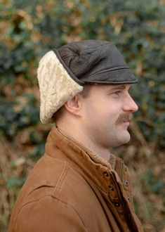 A beautifully crafted genuine sheepskin trapper hat that is both practical and stylish. Made with soft Nappa leather bound with a genuine real sheepskin inner, sheepskin and leather sides and sheepskin ear detail. The ear flaps can be clipped together either under the chin for cold weather or over the top for less windy days. Hand wash only. Sizes. Medium - 60cm. Large - 62cm. XLarge - 64cm. All Photographs and illustrations including but not limited to size and care guides are protected by copyright of the owner Lambland Limited. Copying, altering and using this copyrighted material will result in legal action. Images not owned by Lambland have been licensed for use through the creator. Winter Windproof Leather Hat, Leather Windproof Hats For Outdoor Use, Winter Leather Windproof Hat, Leather Hat With Ear Flaps For Outdoor, Brown Hats With Ear Flaps For Outdoor Activities, Brown Hats With Ear Flaps For Outdoors, Brown Leather Hats With Faux Fur Lining, Winter Leather Hats For Outdoor, Leather Winter Hat For Outdoor