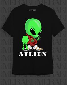 an alien t - shirt with the words'alien'printed on it, sitting in front of a black background