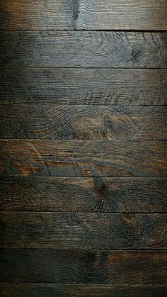 an image of dark wood textured with natural light from the sun shining on it