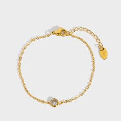 Embrace understated elegance with our "Kendall Bracelet." This delicate and dainty piece features a single diamond on a slender chain, exuding a timeless beauty that is both pretty and refined. Perfect for everyday wear or special occasions, this bracelet effortlessly adds a touch of subtle sparkle and sophistication to any outfit. Nickel, lead, alloy, brass free Hypoallergenic Waterproof Anti-tarnish 10 inches Jewelry Care Sterling Silver To make the most out of your newest addition, we recomme Understated Elegance, Ring Bracelet, Earring Necklace, Jewelry Care, Timeless Beauty, Necklaces Bracelets, Lotion, Everyday Wear, 18k Gold