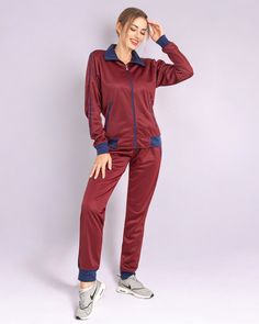 This women's 2-piece tracksuit features a comfortable track material suitable for any age and all sorts of casual and sports activities. Tracksuits have always been in mainstream fashion trends and the elegant color combinations has made this 2-piece tracksuit a top choice for every day activewear. Many traditional outlets do carry trimmed jogger track pants with full zip up track jackets but not many carry a matching 2-piece jogging outfit. This matching 2-piece jogging outfit is available in regular sizes from XS to XL and also plus size are available as 2XL and 3XL. Rest assured that these jogging suits run true to size and offer a relaxed and comfortable fitting for all ages. Specifications: Jogger style track pants Full zip up track jacket with 2 zippered side pockets Matching 2-piece Fall Tracksuit For Jogging With Pockets, Sporty Stretch Tracksuit With Pockets, Sportswear Tracksuit With Pockets For Gym, Winter Jogging Athleisure Sets, Fall Sports Tracksuit With Pockets, Tracksuit With Pockets For Jogging, Sporty Sets With Pockets For Fall, Sportswear Tracksuit With Pockets For Jogging, Fitted Tracksuit For Leisure In Sportswear Style