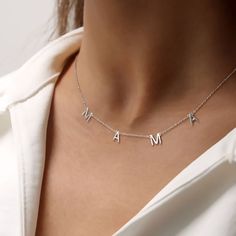 The necklace featuring the endearing message "Mama." Versatile and timeless, this classic piece effortlessly complements any look. The delicate chain adds a touch of charm, while the "Mama" lettering beautifully expresses your love. Silver Minimalist Name Necklace For Mom, Silver Minimalist Name Necklace As Gift For Mom, Silver Initial Necklace For Mother's Day, Dainty White Gold Name Necklace For Mother's Day, Mother's Day Sterling Silver Initial Necklace In White Gold, Mother's Day White Gold Sterling Silver Initial Necklace, Mother's Day White Gold Dainty Name Necklace, Mother's Day Dainty White Gold Name Necklace, Silver Initial Necklace With Clavicle Chain For Mother's Day