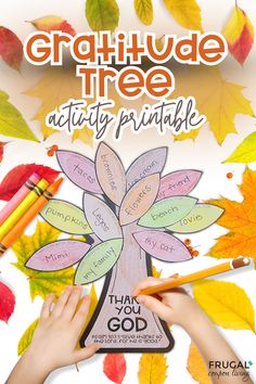 a child's hand holding a pencil and writing on a tree with leaves around it