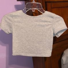 This Is Brand New With Tags Grey Shirt Sleeved Shirt. It Is A Size 4 And Runs Small Fitted Basic Plain Tops, Casual Gray Crop Top, Trendy Cropped Gray Tops, Trendy Gray Cropped Tops, Gray Fitted Cotton Top, Fitted Gray Cotton Tops, Fitted Cotton Plain Tops, Fitted Plain Cotton Tops, Plain Cotton Crop Top For Spring