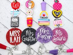 several different key chains with the words miss and mrs jackson on them, all decorated in different colors