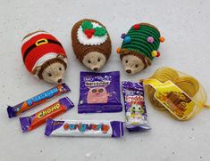 several stuffed animals and candy on a table