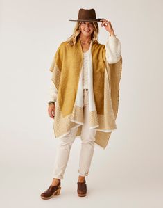 The Poncho that completes, and better yet, matches, every outfit in your closet. Reverse from a light khaki to a warm wood color. This poncho is what it means to be stylish yet effortless. Beige Poncho For Layering, One Size Beige Poncho For Layering, One Size Beige Outerwear For The Beach, Beach Cape Shawl For Fall, One Size Brown Beach Outerwear, Cream Poncho For Beach In Fall, Cream Poncho For Fall Beach Trips, One Size Brown Outerwear For Beach, Beige Poncho For Spring Layering