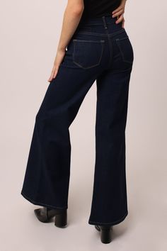 High rise wide leg jeans. It's the trusted fit that sits at natural waist and easy fitting in the hips and thigh. Full inseam on comfort stretch denim accented with tailored center inseam press & washed in original rich dark indigo shade.11 1/2" Front Rise (include waistband), 24 1/2" Leg Opening, 31" inseam (on Model size 27) 98% COTTON 2% SPANDEX Machine wash cold, Tumble dry low Imported Zip fly and button closure Five-pocket style Luxury Dark Wash Short Length Bottoms, Luxury Mid-rise Dark Wash Pants, Luxury Dark Wash Rigid Denim Jeans, Luxury Dark Wash Buttoned Jeans, Luxury Dark Wash Garment Washed Jeans, Luxury Dark Wash Tapered Leg Bottoms, Luxury Dark Wash Cropped Leg Bottoms, Luxury Stretch Dark Wash Bottoms, Luxury High Waist Dark Wash Flare Jeans