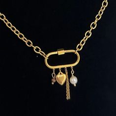 The Carabiner Charm Lock Necklace 🤍 18k gold plated stainless steel at the length of your choice! (If you don't see your desired length in the drop down menu, send me a message. I am always happy to customize!)  ✨lobster clasp and extender added for adjustability!  featuring a mini lock, crystal bead, gold drop chain, and a mini key pendant!  Hypoallergenic & tarnish resistant 😊 Made with love 🫶 Gold Stainless Steel Jewelry With Paperclip Chain, Gold Oval Stainless Steel Necklace, Oval Gold Stainless Steel Necklace, Gold Chain Link Necklace With Carabiner Clasp, Gold Stainless Steel Oval Link Necklaces, Gold Oval Link Stainless Steel Necklace, Chain Necklace Gold, Lock Necklace, Carabiner Clip