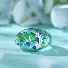 How beautiful is this sweet spring ring? The ring features flowers and leaves that wrap around your finger, detailed with bright enamel for lovers of colour! The perfect accessory for spring and summertime, or to keep the floral vibe going all year round.Carat Weight: 0.072 ctStone Size: 1.4 mmNumber of Stones: 3 Stone Shape: RoundStone Color: Diamond WhiteWeight: 4.79 gWidth: 3.7 mmHeight: 7.7 mmThickness: 1.6 mmMaterial: 925 SilverPlating Color: Silver Enamel Jewelry For Spring Gifts, Spring Enamel Jewelry As Gift, Spring Enamel Jewelry For Gifts, Spring Gift Enamel Jewelry, Green Enamel Wedding Ring, Green Rings As Summer Gift, Green Rings Suitable For Summer Gifts, Wedding Green Enamel Ring, Green Rings For Summer Gifts