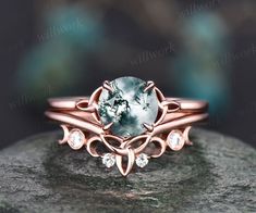 This ring is handmade by myself. The main stone is a 7mm round cut natural moss agate. The wedding band stones are moissanites. The material is solid 14k gold(white,yellow,rose gold is also available) Ring size can be choose from the selection box. Matching band available: https://www.etsy.com/shop/willwork?section_id=20674906 This jewelry can also be made in solid 10k,14k,18k gold,with real diamonds.Contact me! Need rush order? contact me! Need custom making order? Contact me! I have confidence Character Photoshoot, Fantasy Accessories, Moissanite Wedding Ring Set, Moss Agate Engagement Ring, Ring Inspo, Agate Engagement Ring, Viking Ring, Moss Agate Ring, Opal Ring Gold