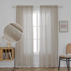 a chair and table in front of a window with curtains on the windowsills