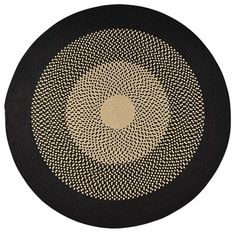 a black and beige area rug on a white background with an oval design in the center