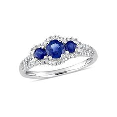 three stone ring with diamonds and blue sapphires