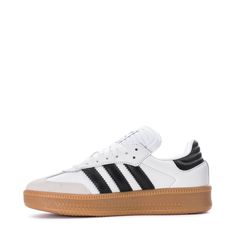 The Samba started as an indoor soccer trainer, but for over 70 years, it's been a staple off the field. The adidas Samba XLG youth shoes bring a fresh twist to the classic with an oversized design and a mix of leather and suede. The timeless colors keep the style effortlessly simple. Pair them with baggy jeans and a graphic tee for a casual day out or with wide-leg pants and your favorite bucket hat for a go-to look.Features: Classic lace closure. Woven "adidas SAMBA" tongue label. Printed "SAMB Adidas Low-top Basketball Shoes With Gum Sole, Adidas Skate Shoes With Gum Sole For Sports, Soccer Trainer, Kicks Shoes, Indoor Soccer, Adidas Tee, Youth Shoes, Black Gums, Backpack Sport