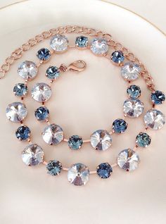 Gorgeous necklace featuring Swarovski crystals in various sizes and colors - - Dusty blue 12mm round crystals alternating with 8mm round crystals in denim and steel blue. The necklace is adjustable between 15 and 19 inches. Rose gold finished metal, as shown. Thanks for stopping by! Blue Crystal Embellished Jewelry Gift, Blue Crystal Embellished Jewelry For Gift, Blue Crystal Necklace For Wedding, Blue Crystal Necklaces For Wedding, Bracelet Display, Necklace Bridal, Swarovski Crystal Necklace, Necklace Display, Elegant Bracelet