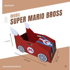 a cardboard model of a red car with white wings and the words mobil super mario bros on it