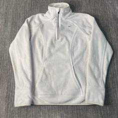 Vintage 2000s Nike Swoosh Check Sportswear Athletic Y2K Aesthetic Streetwear White Half Zip Up Fleece Sweater Medium Women Condition:   Fair Used Condition  = Staining On The Front Of The Sweatshirt Due To Age And Wear Measurements: Please see photos above for all measurements IF YOU BUY TWO OR MORE ITEMS USE THE CODE BUNDLE @ CHECK TO SAVE 20% WE SHIP WITHIN 24 HOURS AFTER PURCHASE! Please be aware that we do not offer free returns!! The Buyer is responsible for the cost of the return label.  Follow us on TikTok & Instagram @findsnostalgic and tag us in your finds Sports Half-zip Fleece Sweatshirt, Sporty Fleece Sweatshirt For Winter Sports, Functional Fleece Sports Tops, White Moisture-wicking Sweatshirt For Winter, White Long Sleeve Winter Activewear, Sporty Long Sleeve Fleece Jacket For Sports, Moisture-wicking Long Sleeve Fleece Jacket, White Winter Sportswear Activewear, Moisture-wicking Fleece Sports Top