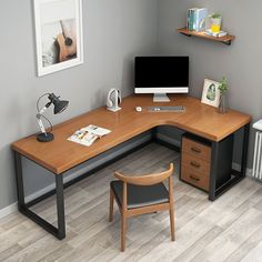 a corner desk with a computer on it