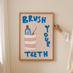 a woman standing in front of a poster with toothpaste on it