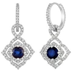 The earrings are 18K White Gold There are 0.80 Carats In Diamonds F/G VS/SI There are 1.47 Carats In Blue Sapphires The round sapphires are prong set in a double square halo The earrings measure 1" x 0.50" The earrings weigh 4.8 grams The dangle part can be removed from the hoop. The hoops can be worn by themselves. Sapphire Earrings With Diamond Accents For Evening, Evening Earrings With Sapphire And Diamond Accents, Evening Sapphire Earrings With Diamond Accents, Gia Certified Drop Diamond Earrings For Formal Occasions, Luxury Sapphire Diamond Earrings With Brilliant Cut, Luxury Gia Certified Dangle Diamond Earrings, Gia Certified Sapphire Jewelry For Formal Occasions, Fine Jewelry Sapphire Earrings With Diamond Cut, Gia Certified Fine Jewelry Earrings For Formal Occasions