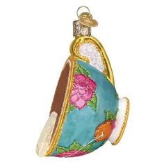 an ornament shaped like a purse with flowers on it