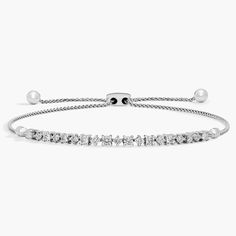 At once brilliant and vibrant, this petite 14k white gold bracelet draws its allure from round-cut diamonds. This wheat chain bracelet adjusts up to 10 inches and is secured with a bolo clasp. Bolo Bracelet, White Gold Bracelet, Blue Nile, Diamond Fashion, Round Cut Diamond, Fashion Bracelets, Chain Bracelet, Rhodium Plated, Prong Setting