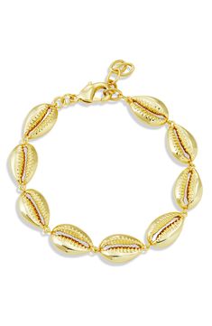 Show off beachy style with this cowrie-shell bracelet plated in gleaming 18-karat yellow gold for eye-catching shine. 1/2" width Lobster clasp closure 18k-gold plate Imported Italian Summer Jewelry, Yellow Gold Jewelry For Vacation, Adjustable Gold Shell-shaped Bracelet, Gold Shell-shaped Bracelet For Vacation, Elegant Gold Bracelets For Vacation, Gold Shell Bracelet For Vacation, Beach Jewelry With Gold Cowrie Shell, Gold Cowrie Shell Jewelry For The Beach, Gold Shell Jewelry For Vacation