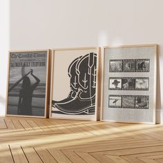 three framed photographs with cowboy boots on them in front of a white wall and wooden floor